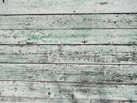 Old wooden background from the remains of paint and traces of useの写真素材