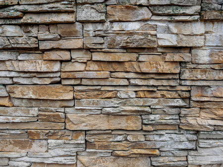 Texture of a stone laying from the gray and yellow stone put in any order.の写真素材