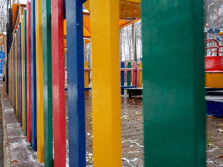 Multi-colored protection of the playground in the park in the fall.の写真素材
