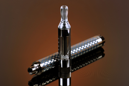 Vape (electronic cigarette) in the sorted look against a dark background.の写真素材