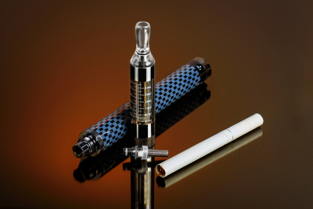 Electronic cigarette (vape) in the sorted look against a dark background.の写真素材