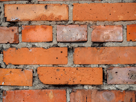 Old brick wall of red brick close-up.の写真素材