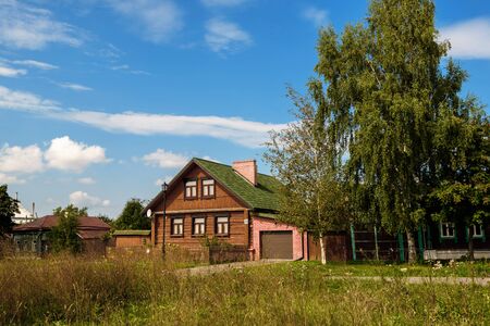 Old wooden rustic house a sunny summer day.の写真素材