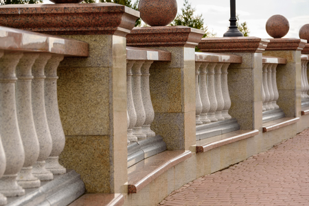 Stone balustrade from granite and pavement close-up.の写真素材