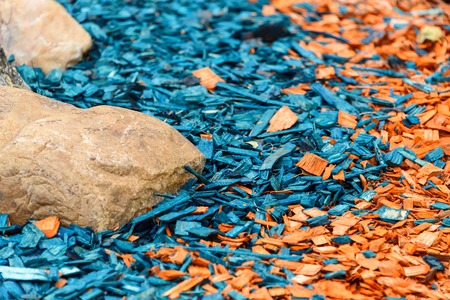 Painted decorative wooden sawdust is orange and blue.