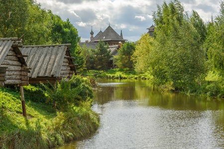 Old wooden houses on the river bank in summer.の写真素材