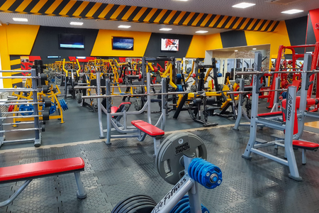 Equipment and fitness equipment in the empty modern gym in the fitness center.のeditorial素材