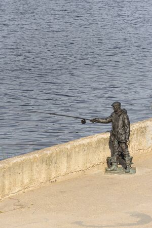 Monument to the fisherman on the banks of the Volga River in the city of Tver.の写真素材