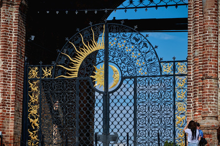 Beautiful forged gates with signs of the zodiac, the moon and the sun. Black metal gates.のeditorial素材