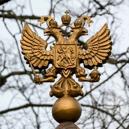 Coat of arms of Russia in gold close-up in the open air. Coat of arms of Russia close-up.の写真素材