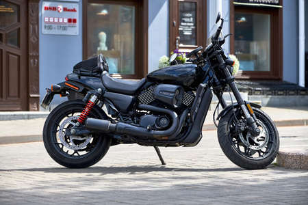 Belarus, Minsk, August 2019. Black modern motorcycle without a driver on a city street.のeditorial素材