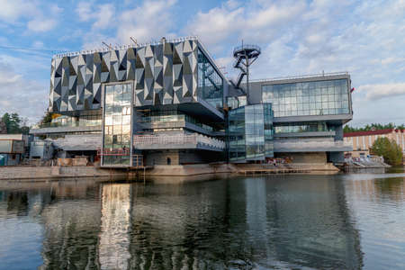 Modern building of the fishing industry pavilion on the lake shore at the VDNH exhibition.