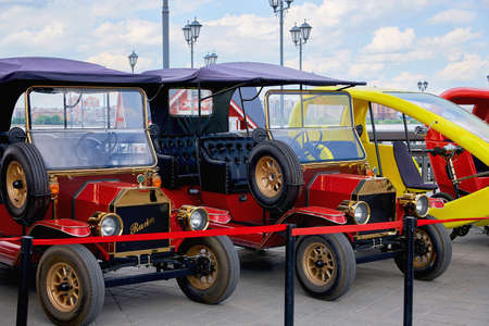 Cash banknotes and coins background. The background of the American and Russian money banknotes and coins. Dollars and rubles background.のeditorial素材