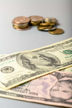 Cash banknotes and coins dollars background. Background of American money banknotes and coins.の写真素材
