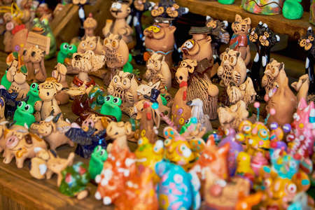 Belarus, Minsk, August 2019. A small street shop selling Souvenirs. A large assortment of clay Souvenirs.のeditorial素材