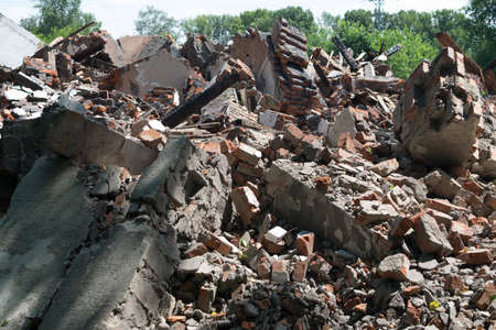A ruined apartment building as an illustration of an earthquake or war. Abandoned housing in a...