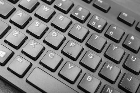 Black keyboard keys closeup. Macro shot of keyboard buttons, pc hotkey, keystroke photo