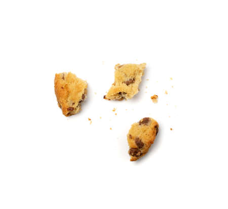 Simple crumbled cookie isolated. Broken oatmeal sugar bitten cookies, chocolate chip biscuit pieces. Round broken biscuit top viewの写真素材