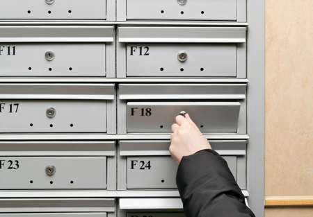Mailboxes in condominium. Mail boxes in apartment entrance, residential building mailbox, lobby service with modern lockers, privacy letterboxes, correspondence conceptの写真素材
