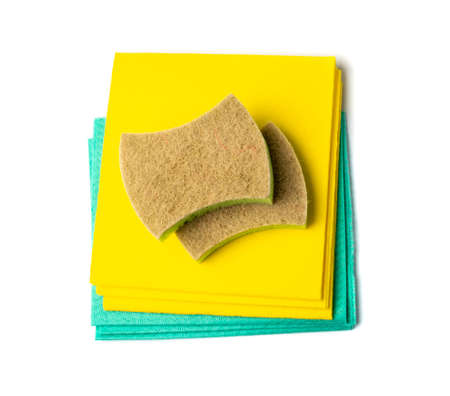 Cleaning cloth stack isolated. Wipe rag, cleaning microfiber towel, wiping cotton napkin, yellow and green microfiber fabric, kitchen cloths on white background top viewの写真素材