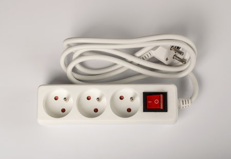 Power strip on white background. Extension cable, electricity strip, home socket, power extender,...