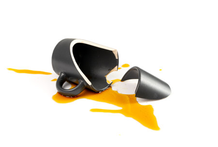 Broken Mug Isolated, Black Ceramic Cup Pieces, Smashed Teacup, Careless Concept, Empty Broken Mug on White Backgroundの写真素材