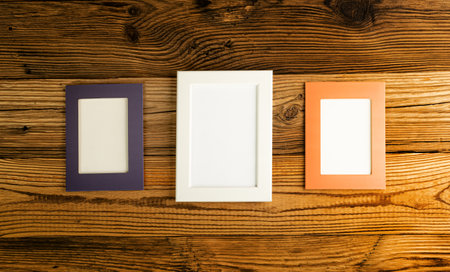 Blank Paper Photo Frames Top View, Empty White Frame on Wood Table Flat Lay Mockup, Pleasant Memories Concept, Paper Photo Frames Texture Background with Copy Spaceの写真素材