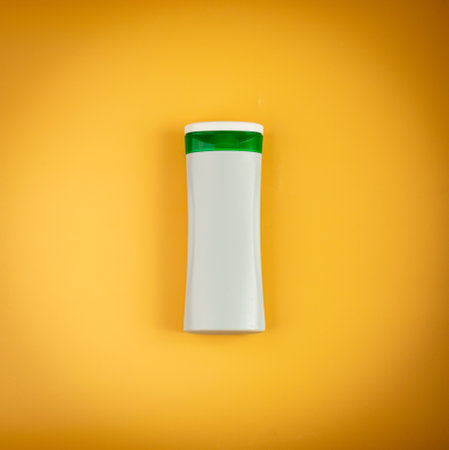 Shampoo Bottle on Yellow Background, Liquid Soap Plastic Container, Shower Gel Tube, Hair Conditioner Box, Shampoo Bottle Mockup with Copy Spaceの写真素材