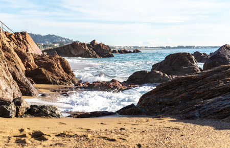 Foamy Sea Waves, Storm on Rocky Beach Texture Background, Blue Ocean Water, Rocky Shore Pattern, Stone Shoreline, Vacation Conceptの写真素材