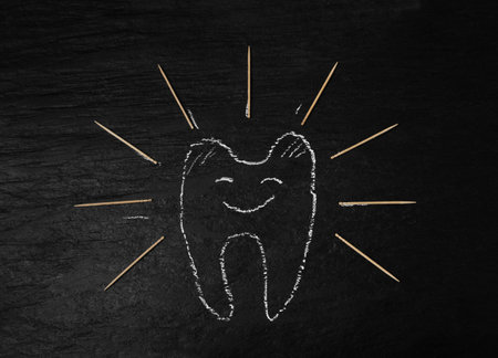 Wooden Toothpicks on Black Background with Copy Space, Flat Lay Tooth Picks, Wood Toothpicks Top View Mockup with Space for Text, Daily Dental Care Concept Bannerの写真素材