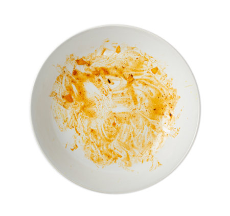 Dirty Plate Isolated, Empty Bowl after Dinner, Finished Lunch, Oil and Smeared Sauce on White Plate Background Top Viewの写真素材