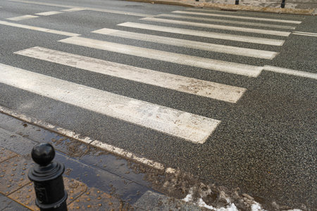 Winter Pedestrian Crossing, Black White Crosswalk after Rain, Safety Zebra on Modern Tiles Pathwayの写真素材