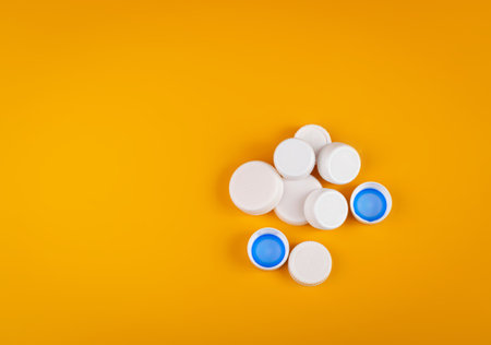 Plastic Bottle Caps Pile. Recycling HDPE Material Group, Circle Polyethylene Lid Set, Colorful Caps...