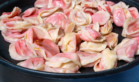 Dumplings with Cherries, Traditional Cherry Pierogi, Sweet Strawberry Vareniki, Fruit Ravioli, Sweet Stuffed Pelmeni Closeup at Street Fair, Street Food in Eastern Europeの写真素材