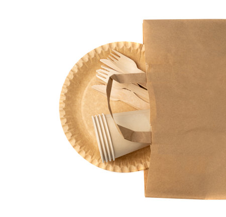 Paper Plate, Fork, Knife Isolated in Paper Bag, Eco Tableware Set, Disposable Cutlery, Biodegradable, Eco Bio Table Setting for Picnic, Recycle Reusable Utensil on White Backgroundの写真素材