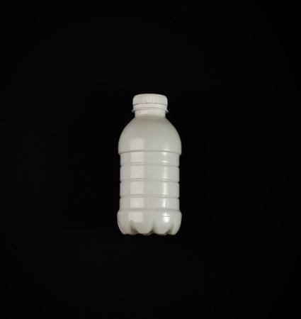 Empty Plastic Milk Bottle, White Plastic Bottle, Global Pollution Concept, Pet Bottles on Black...