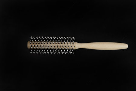 Wood Round Hairbrush on Black Stone Texture Background, Natural Wooden Massage Hair Brush, New Round...