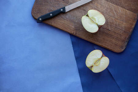 Apple on blue backgroundの写真素材
