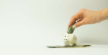 Hand with money isolated on a white background, isolateの写真素材