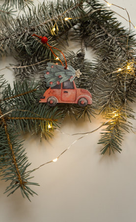 New Year's recipe from fir branches and Christmas tree wooden toys. Preparing for the New Year. Christmas background for presentation of work or text. Copy space. View from aboveの写真素材