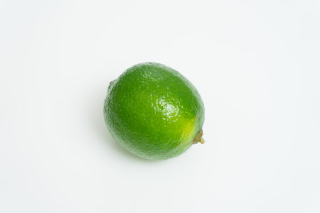 Juicy very fresh lime on a white background. Isolatedの写真素材