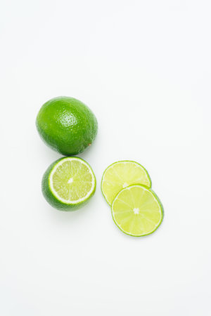 Ripe green lime citrus lime slice on white background. isolate