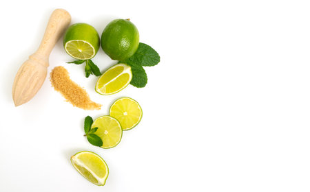 Mojito ingredients. Lime, mint and cane sugar isolated on white background. Sweet sugar, mint leaves and lime.の写真素材