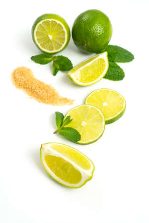 Mojito ingredients. Lime, mint and cane sugar isolated on white background. Sweet sugar, mint leaves and lime.の写真素材