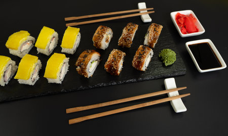 Sushi selection on black slate, black food border backgroundの写真素材