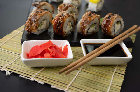 Sushi selection on black slate, black food border backgroundの写真素材