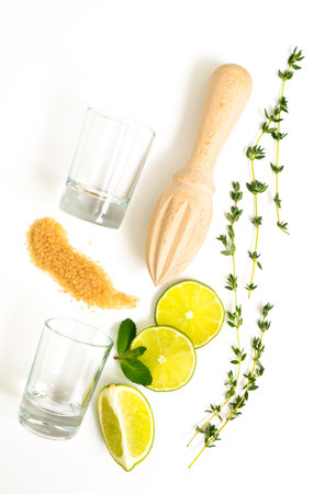 Mojito ingredients. Lime, mint and cane sugar isolated on white background. Sweet sugar, mint leaves and lime. rosemary, thymeの写真素材