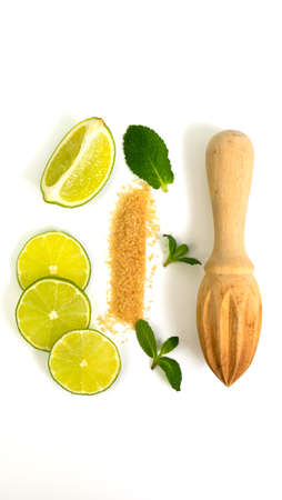 Mojito ingredients. Lime, mint and cane sugar isolated on white background. Sweet sugar, mint leaves and lime.の写真素材