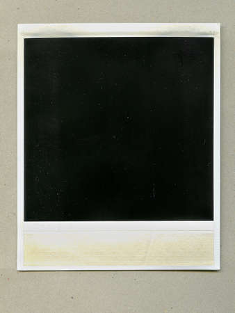 Retro vertical blank black instant aged photo frame with shadow and dust, plastic border isolated on...