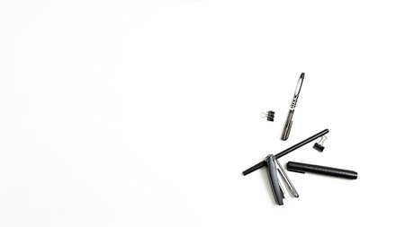 office stationery randomly scattered on white background, flat lay. copyspaceの写真素材